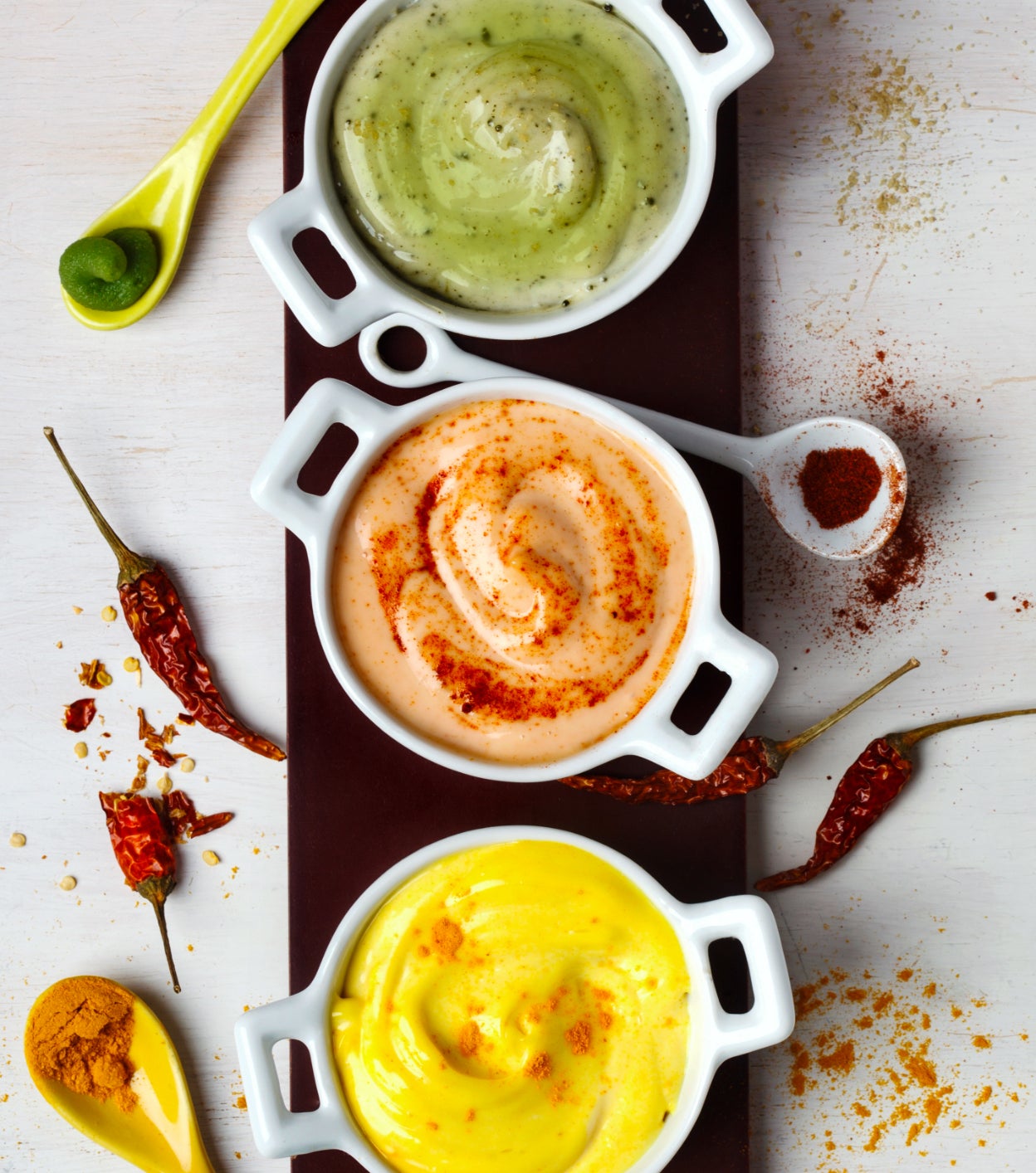 Overhead shot of three colorful sauces made with Minor’s ingredients