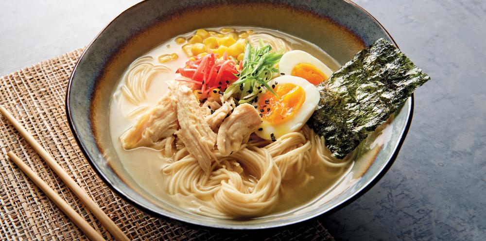 A bowl of Chicken Ramen with egg and nori sheet