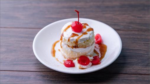 Bourbon Old Fashioned Orange Cake topped with a cherry