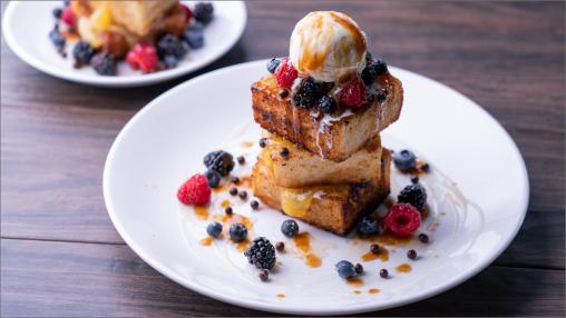 Bourbon & Honey Toast topped with a scoop of vanilla ice cream