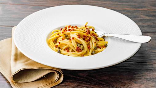 Bucatini with a Lemon Carbonara in a dish with a fork