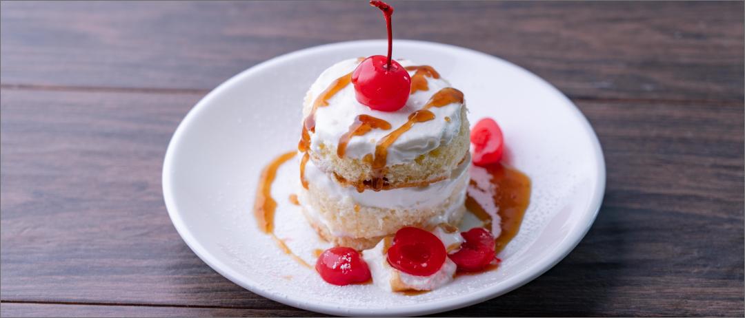 Bourbon Old Fashioned Orange Cake topped with a cherry