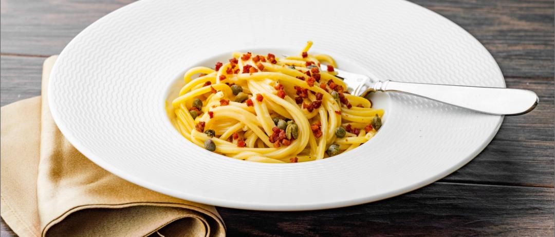Bucatini with a Lemon Carbonara in a dish with a fork