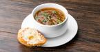 Five Onion Soup in a bowl with bread